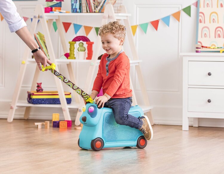 B. Toys On The Gogo Woofer Travel Luggage Ride-On